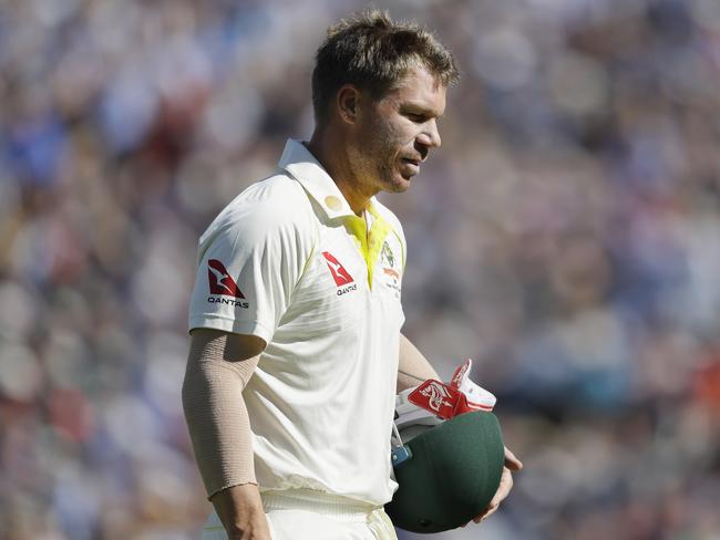 Australia's David Warner leaves the pitch after he is caught by England's Jonny Bairstow off the bowling of England's Jofra Archer during the second day of the fifth Ashes test match between England and Australia at the Oval cricket ground in London, Friday, Sept. 13, 2019. (AP Photo/Kirsty Wigglesworth)