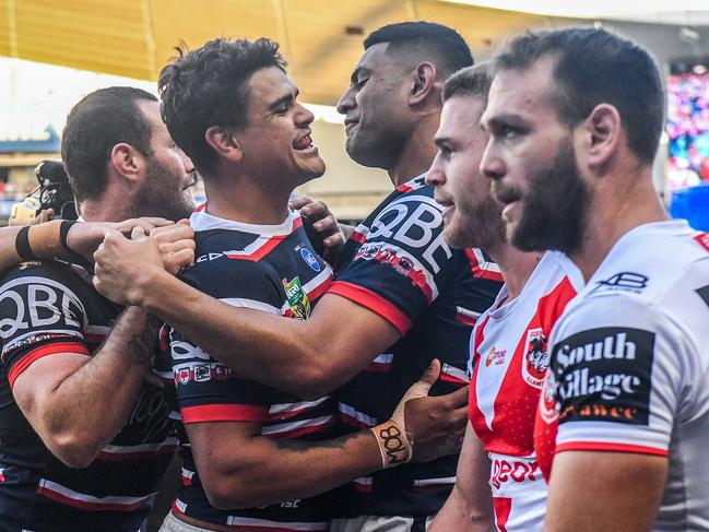 Latrell Mitchell (centre) of the Roosters reacts after scoring against the Dragons during the Round 20 NRL match between the Sydney Roosters and the St George-Illawarra Dragons at Allianz Stadium in Sydney, Sunday, July 29, 2018. (AAP Image/Brendan Esposito) NO ARCHIVING, EDITORIAL USE ONLY