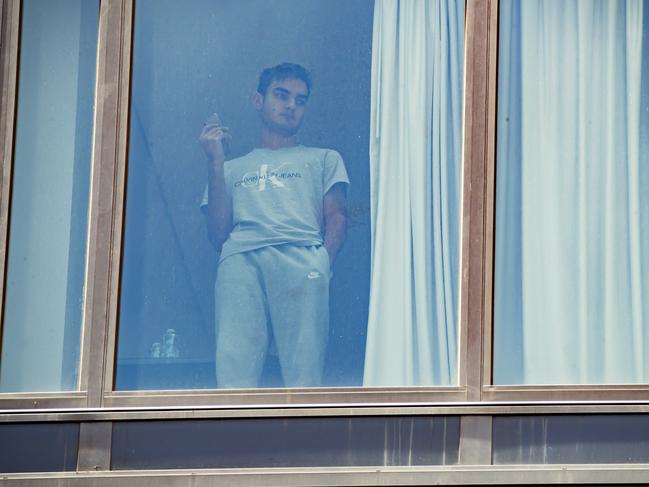 Guests in quarantine at the Westin Hotel in Brisbane CBD after being moved from the Grand Chancellor after a Covid-19 cluster was detected inside the hotel . Picture Lachie Millard