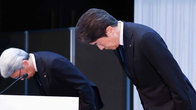 Mazda Motor President and CEO Masahiro Moro (right) bows during a press conference in Tokyo. Toyota said on June 3 it had suspended domestic shipments of three car models after falling foul of government certification rules along with its Japanese rivals Honda, Mazda, Suzuki and Yamaha. (Photo by JIJI Press/AFP).