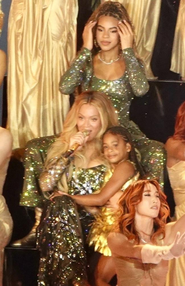 In an adorable moment, younger sister Rumi joined the stage in a gold Oscar de la Renta dress while Blue and Bey twinned in sequined Burberry. Picture: ShotbyNYP / BACKGRID