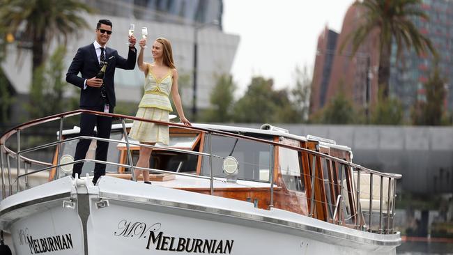 Curtis Garcia and Tristyn Lecia on the boat that Uber has made available for Spring Carnival punters. Picture: Alex Coppel.