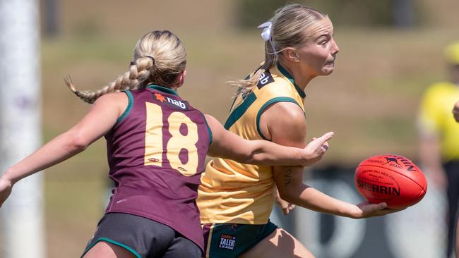 Tayla Hoiberg-Cox passes the ball away from an opponent in the talent program players practice match at Twin Ovals on Sunday 23rd February 2025. Picture: Linda Higginson