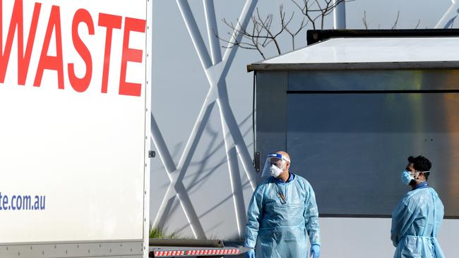 Clinical waste is removed from Epping Gardens Aged Care Home, to which 201 virus cases are now linked. Picture: Andrew Henshaw