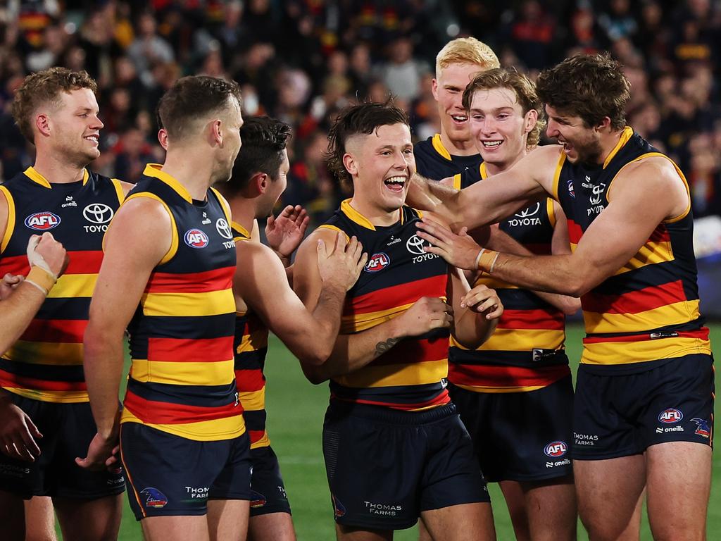 Adelaide players celebrate winning the Showdown in May. Picture: James Elsby/AFL Photos via Getty Images