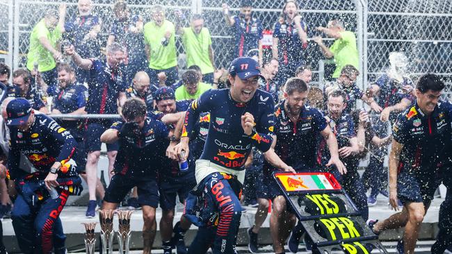 JEDDAH, SAUDI ARABIA – MARCH 19: Race winner Sergio Perez of Mexico and Oracle Red Bull Racing, Second placed Max Verstappen of the Netherlands and Oracle Red Bull Racing and the Red Bull Racing team celebrate after the F1 Grand Prix of Saudi Arabia at Jeddah Corniche Circuit on March 19, 2023 in Jeddah, Saudi Arabia. (Photo by Lars Baron/Getty Images)