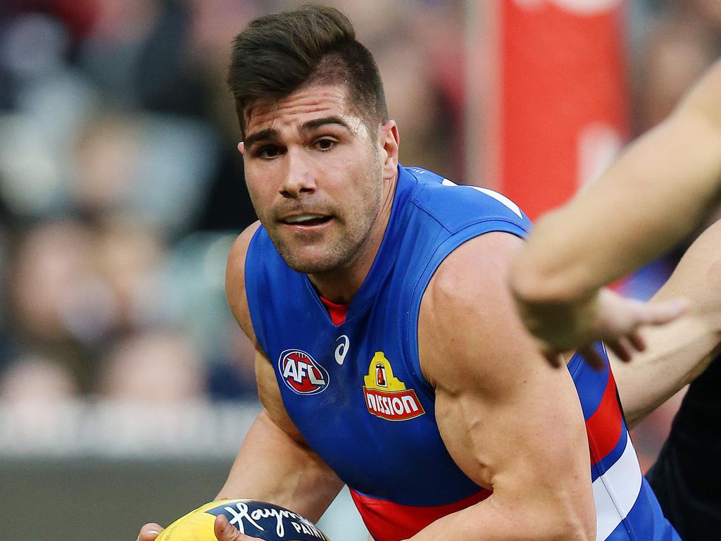 AFL Round 17. 14/07/2018. Melbourne vs Western Bulldogs at the MCG.  Western Bulldogs Marcus Adams cleans up deep in defence    . Pic: Michael Klein