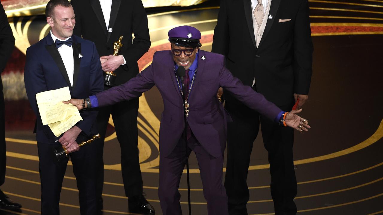 Charlie Wachtel, left, and Spike Lee accept the award for best adapted screenplay for BlacKkKlansman . Picture: AP