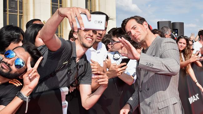 Cavill posing with fans at the premiere of Mission: Impossible — Fallout in Paris this week. Picture: Kristy Sparow/Getty Images