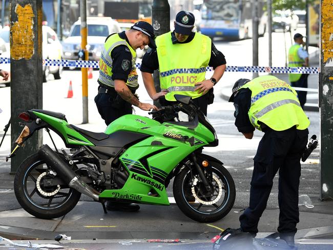 NSW Police establish a crime scene after motorbike rider was struck on Wattle Street in Ultimo, Sydney, Thursday, February 27, 2020. (AAP Image/Joel Carrett) NO ARCHIVING