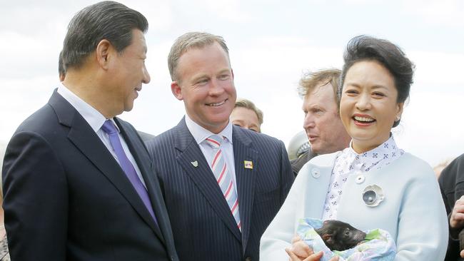 Chinese president Xi Jinping and Madame Peng Liyuan meet a baby Tasmanian devil from Bonorong Wildlife Park with Premier Will Hodgman.