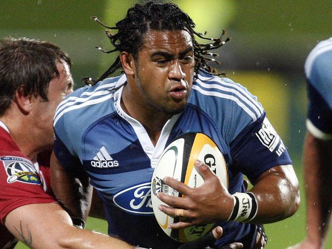 Blues' Taniela Moa is tackled by Reds' Hugh McMeniman during the Blues v Reds S14 match at North Harbour Stadium, Auckland, New Zealand, Saturday, April 25, 2009. (AAP Image/NZPA, Wayne Drought) NO ARCHIVING, EDITORIAL USE ONLY, NZ OUT