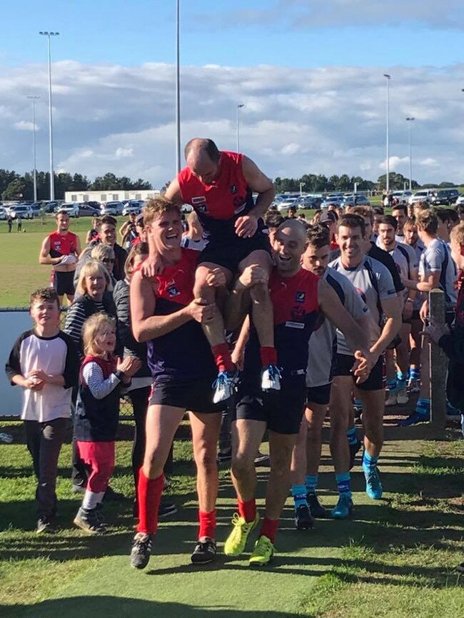 Mt Eliza's Damien Kent is chaired off after playing his 300th game.