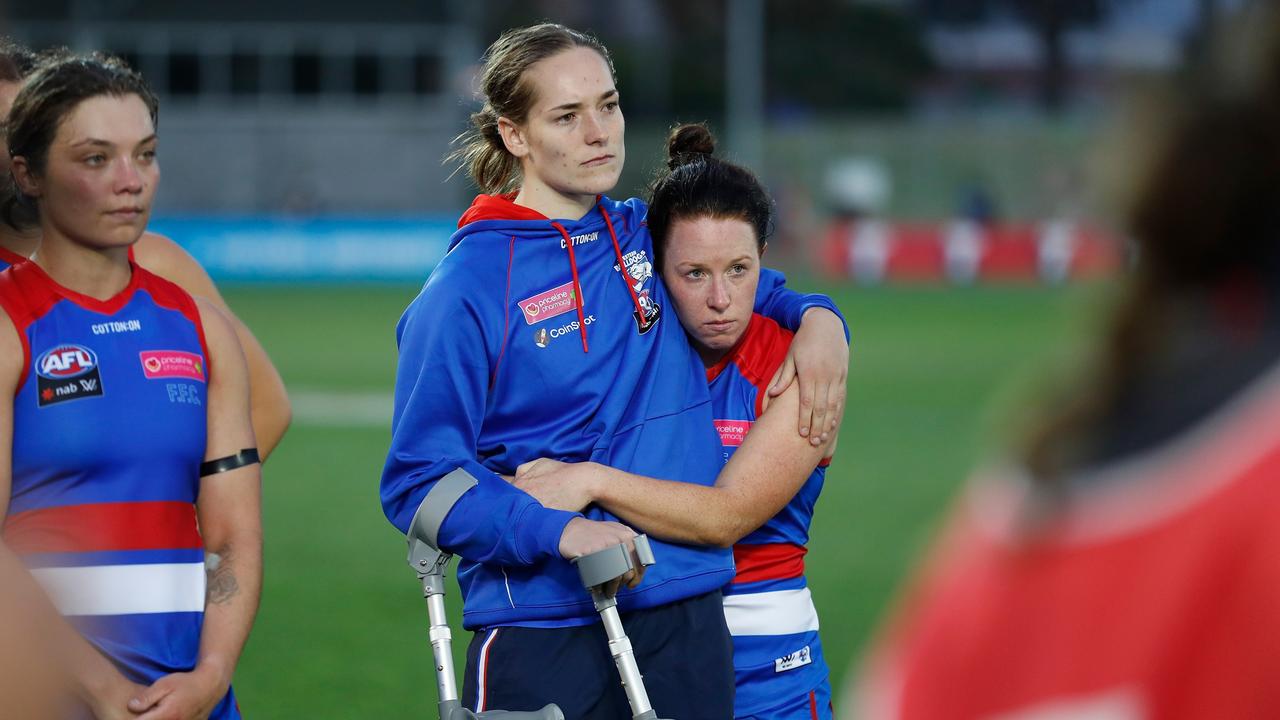 Isabel Huntington of the Bulldogs is consoled by teammate Brooke Lochland. Picture: Michael Willson
