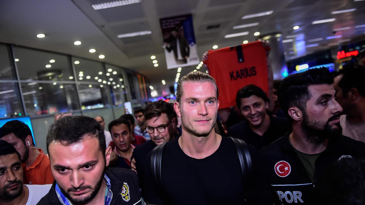 German goalkeeper Loris Karius (C) reacts as he arrives at the Ataturk International Airport in Istanbul to play with Besiktas