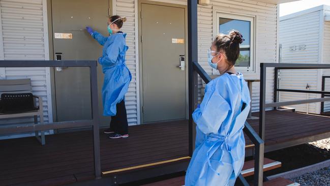 An NT Health worker checking in on a Howard Springs Quarantine Facility resident. Picture: Suppled/ NT Health