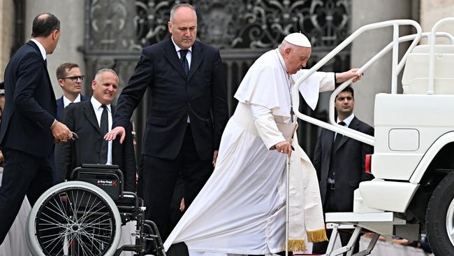 Francis steps into the popemobile at the Vatican on Saturday. Picture: AFP