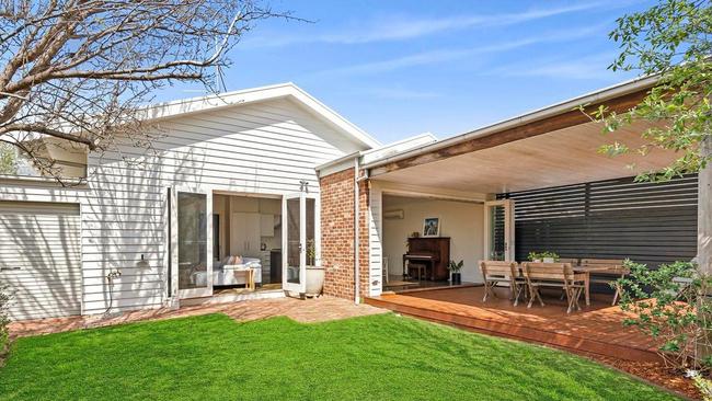 A rear pergola adds to the attractions in the back yard.