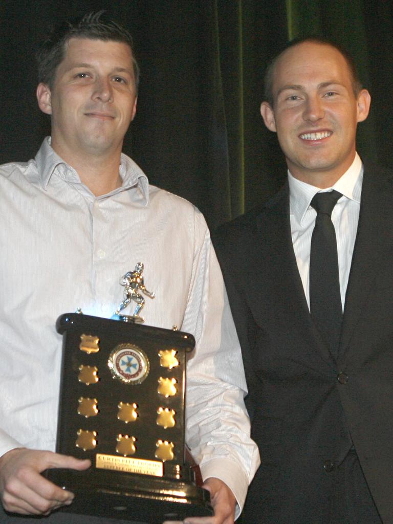 Member for Mulgrave Curtis Pitt (right) congratulates 2009 Cairns District Rugby League referee of the year Michael Inman.