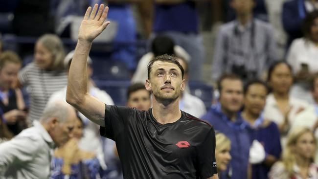 John Millman of Australia celebrates his victory over Roger Federer.