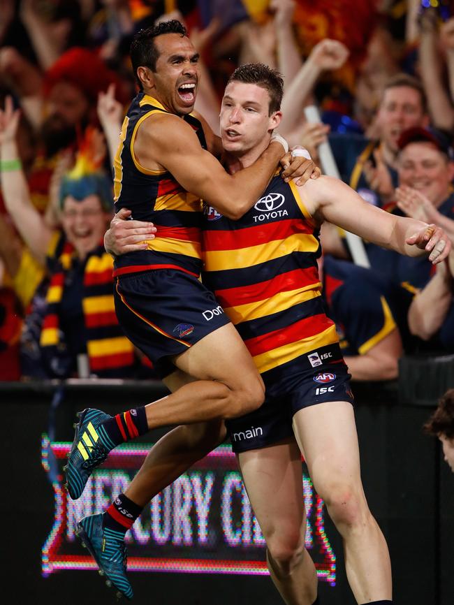 Eddie Betts and Josh Jenkins after the Crows score another goal against the Cats. Picture: Adam Trafford/AFL Media/Getty