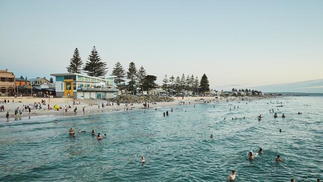 People taking advantage of Adelaide’s warm weather at Henley Beach. Picture: Matt Loxton.