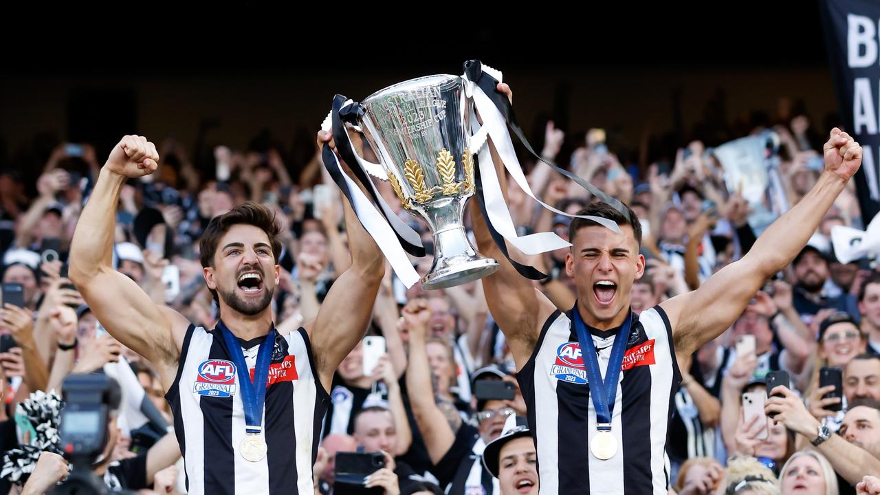 Josh Daicos and Nick Daicos celebrate with the premiership cup. (Photo by Dylan Burns/AFL Photos via Getty Images)