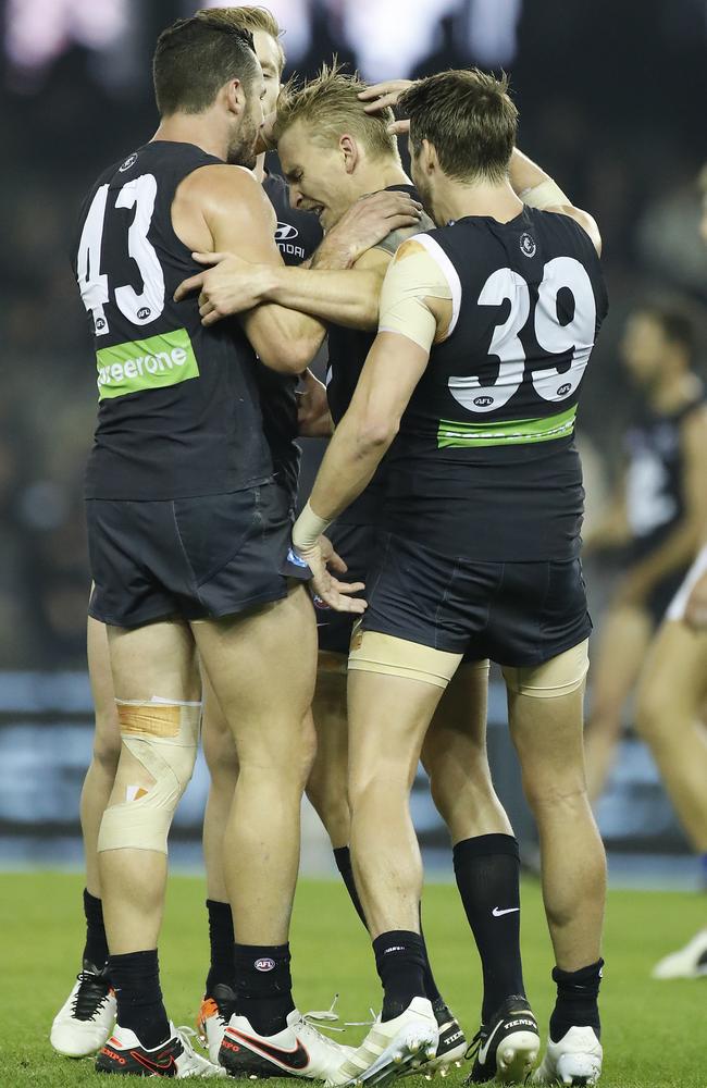 Carlton players celebrate victory. Picture: Alex Coppel.