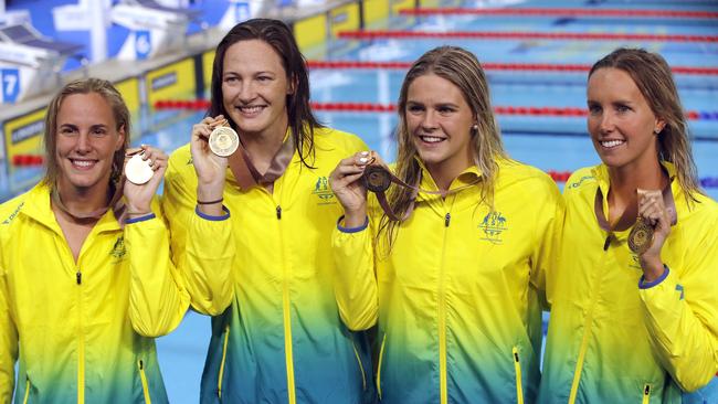 Australia's women's 4x100 freestyle relay team, from left, Bronte Campbell, Cate Campbell, Shayna Jack, and Emma McKeon pose with their gold medals at the Aquatic Centre on the opening night of the 2018 Commonwealth Games on the Gold Coast. Picture: Photo/Mark Schiefelbein