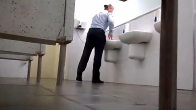 This man was also filmed while using a public toilet.