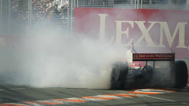 Back in 2005, driver Sebastian Bourdais does burnouts after winning race. Pics: Jono Searle