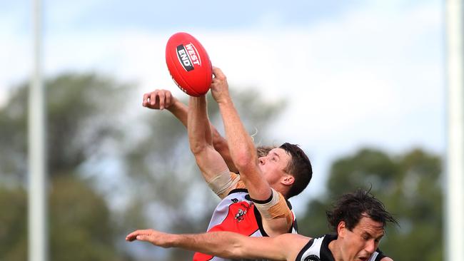 Ryan Spittle (Tea Tree Gully) attempts to mark. Picture: Stephen Laffer