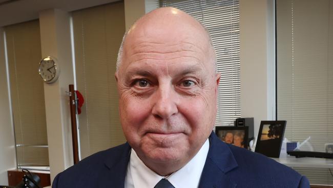 Victorian Treasurer Tim Pallas in his office with the 2023-2024 State Budget report.                      Picture: David Caird