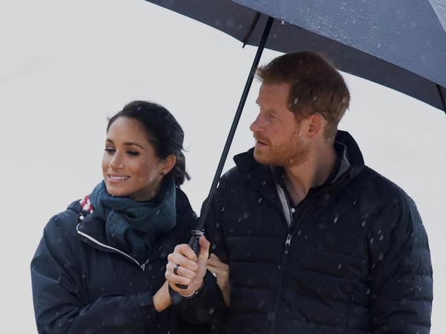 Britain's Prince Harry and Meghan, Duchess of Sussex walk at Abel Tasman National Park in New Zealand, Monday, Oct. 29, 2018. Prince Harry and his wife Meghan are on day 14 of their 16-day tour of Australia and the South Pacific. (Paul Edwards/Pool Photo via AP)