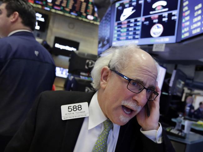 Trader Peter Tuchman works on the floor of the New York Stock Exchange, Monday, April 11, 2016. U.S. stocks opened higher on Wall Street following gains overseas as investors held out hope for more economic stimulus from China. (AP Photo/Richard Drew)