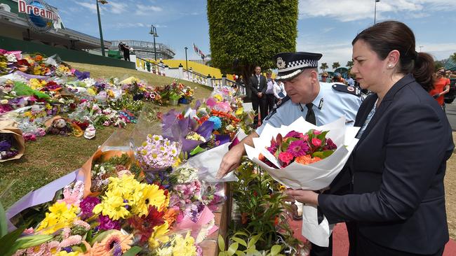 Queensland Premier Annastacia Palaszczuk pays her respects, laying a wreath outside the Dreamworld Theme Park on the Gold Coast. Picture: AAP/Dave Hunt