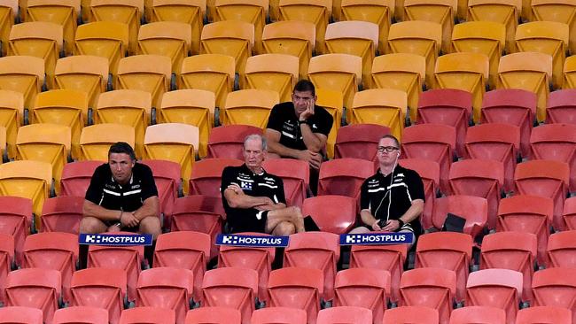 South Sydney coach Wayne Bennett (centre) sits with his coaching staff, including Sam Burgess (left). Picture: Getty Images