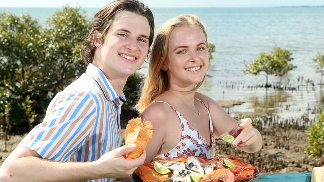 Dante Schick and Indigo Porter promoting the Wynnum Manly Seafood Festival. Picture: Jono Searle/AAP