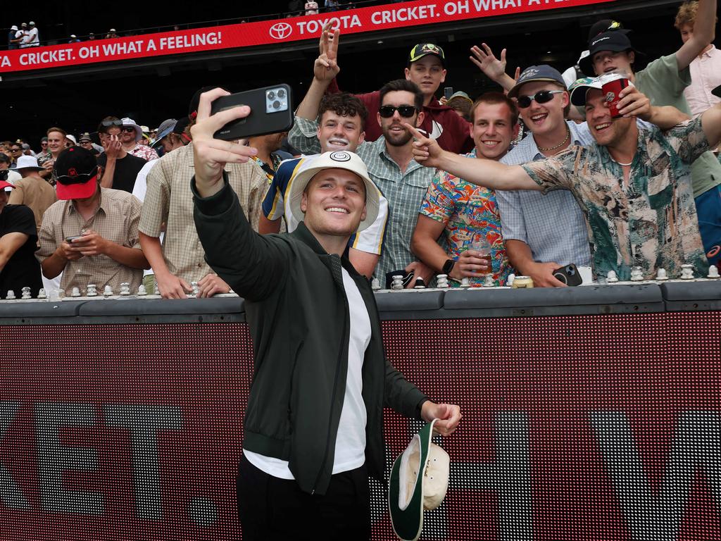 Jackson Warne takes a selfie with fans at the MCG. Picture: Michael Klein