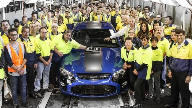 End of an era ... Ford workers at Broadmeadows factory proudly unveil the first car from 