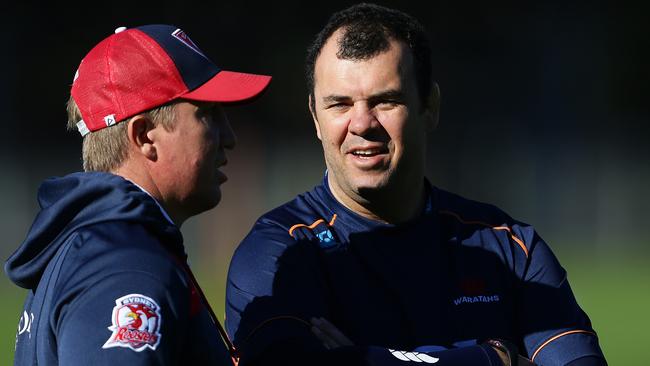 Sydney Roosters coach Trent Robinson with Waratahs coach Michael Cheika during the Sydney Roosters rugby league and Waratahs rugby combined training session at Moore Park, Sydney. Pic Brett Costello