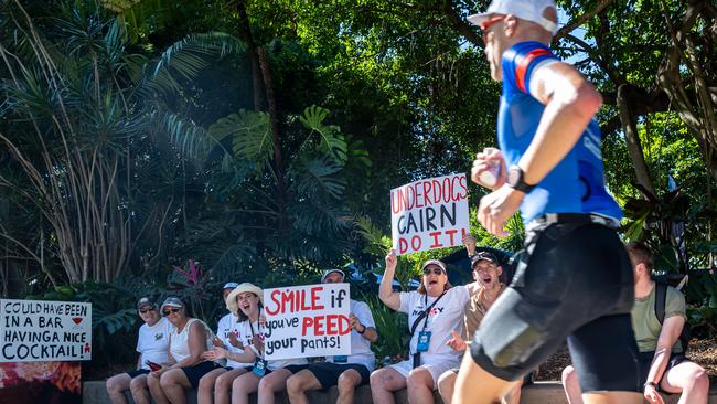 Rob Hamilton of New Zealand cheers on an athlete with his family during The Cairns Airport IRONMAN Cairns. Picture Emily Barker.