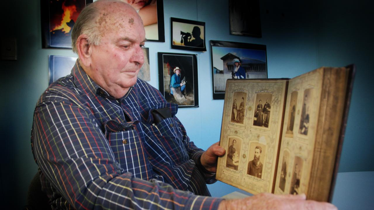 Jim Buchanan with the old photo album of his family history in the Gympie region, which stretched back to the late 19th century. Photo Craig Warhurst.