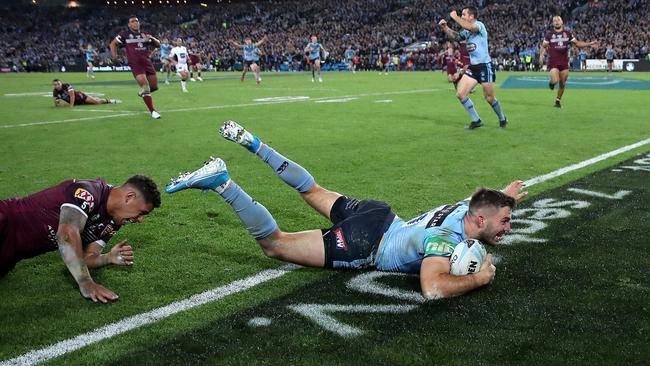 Tedesco slides in with Dane Gagai in his wake. Photo: Phil Hillyard