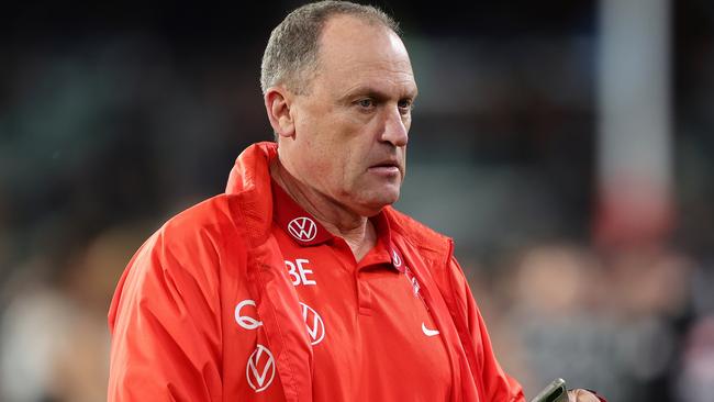 John Longmire’s team will have to defy history to win the AFL flag. Picture: Sarah Reed/AFL Photos via Getty Images