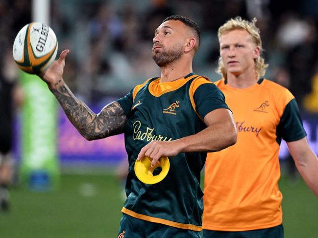 Australian players Quade Cooper (L) and Carter Gordon (R) practice before the Rugby Championship 2023 and Bledisloe Cup Test match between Australia and New Zealand at the MCG in Melbourne on July 29, 2023. (Photo by William WEST / AFP) / --IMAGE RESTRICTED TO EDITORIAL USE - STRICTLY NO COMMERCIAL USE--