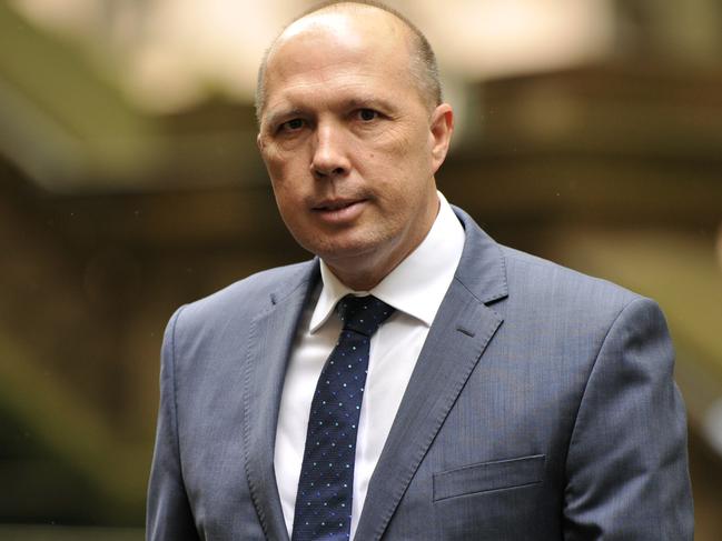 Australian Immigration Minister Peter Dutton arrives at the memorial service for Bill Leak, at Town Hall in Sydney, Friday, March 17, 2017. Leak was an editorial cartoonist and artist at The Australian newspaper, and passed away last week aged 61from a suspected heart attack. (AAP Image/Joel Carrett) NO ARCHIVING