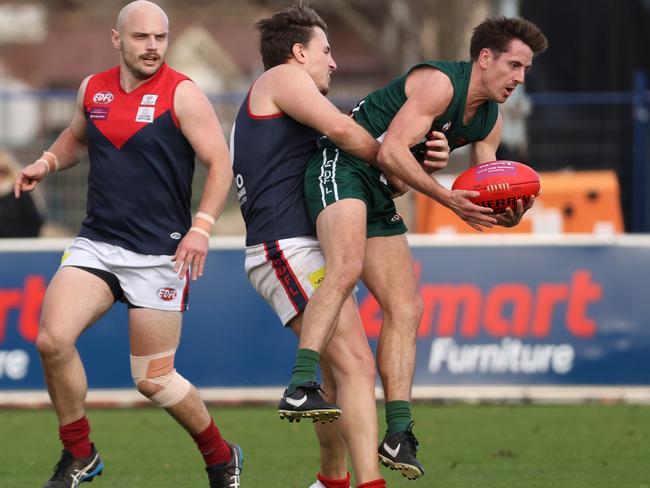 EDFL: Kirk Lang of Tullmarine tackles Airport West’s Jesse McVeigh. Picture: Hamish Blair