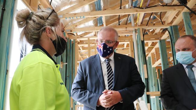 Scott Morrison meets with apprentice carpenter Margaret Hare on a visit to a housing construction site in Officer in Melbourne’s south-eastern suburbs. Picture: David Crosling