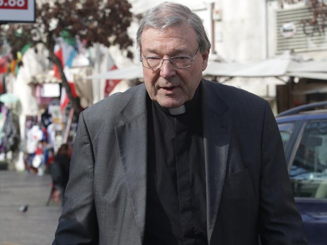 Cardinal George Pell leaves his home near the Vatican and walk to pick up his car in a garage. Picture: Ella Pellegrini